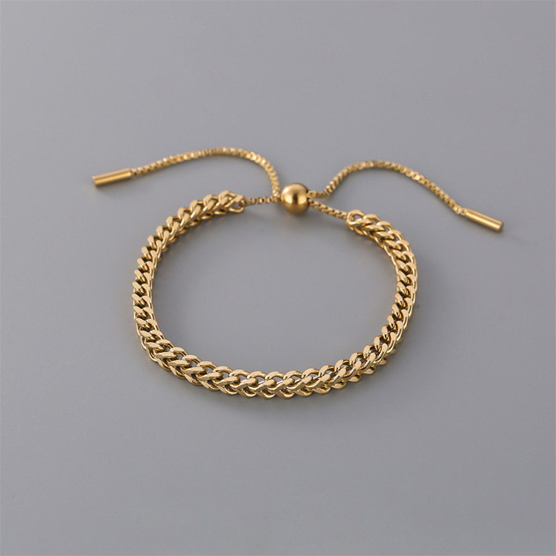 Pulsera tejida de acero titanio enchapada en 18 k.