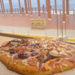 Pizza hecha a Mano, con ingredientes seleccionados